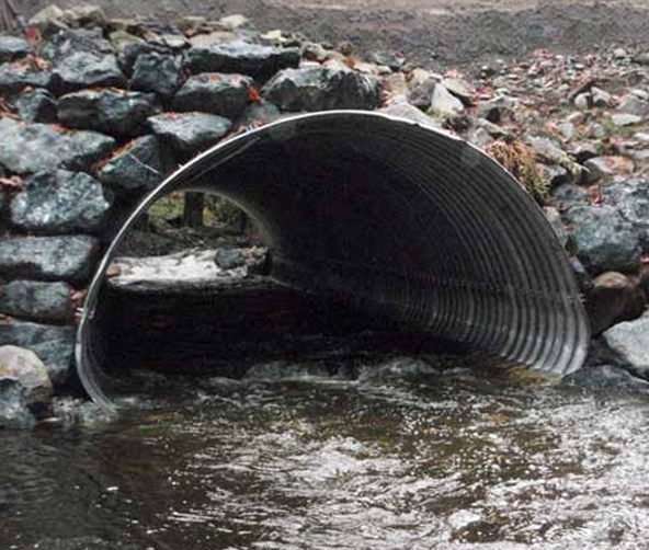 A fish-friendly culvert embedded into the streambed with water flowing through